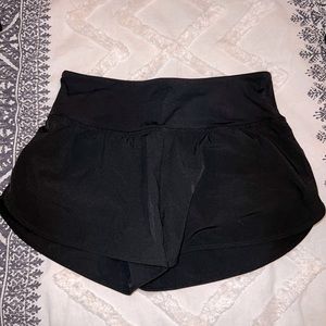 Black high waisted athletic shorts.